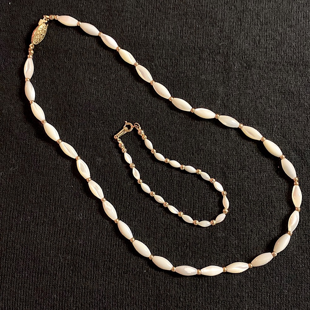 Pearl looking elongated beaded necklace with smaller bead size bracelet